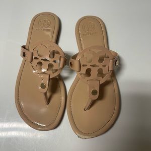 Nude medallion flip flops